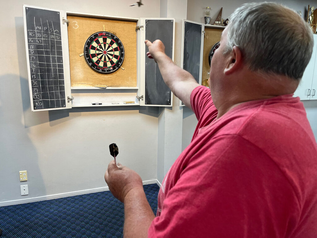 Playing darts at South Taranaki Club